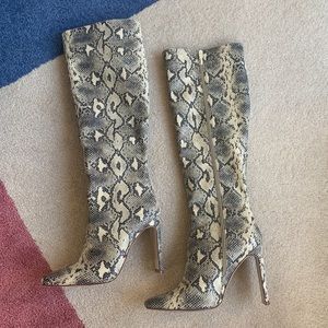 Knee high snake boots
